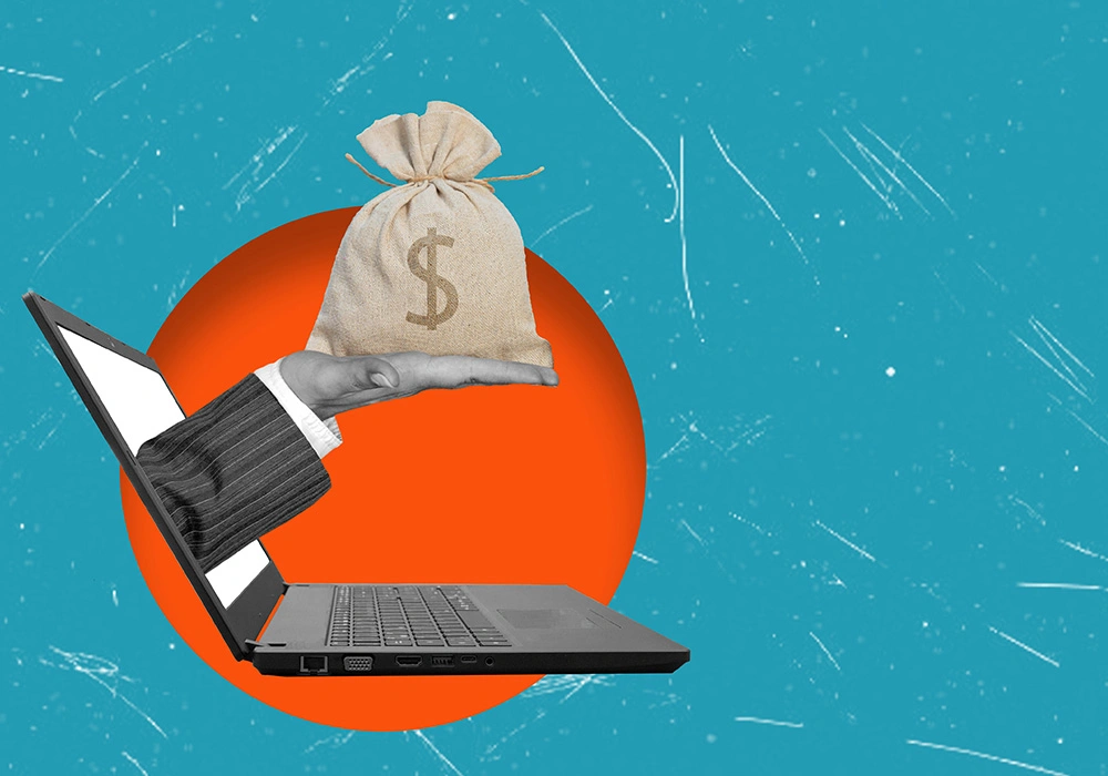 Active vs Passive Investing: Benefits and Key Differences 2 Hand emerging from laptop holding money bag symbolizing online investing profits